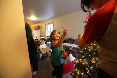 Photo Essay on the Van De Kaere family (including  Cadence, Shannon, Rene and Brendon) finally moving into thier Habitat home just  in time for Christmas.  Dec 16, 2013 Ruth Bonneville / Winnipeg Free Press