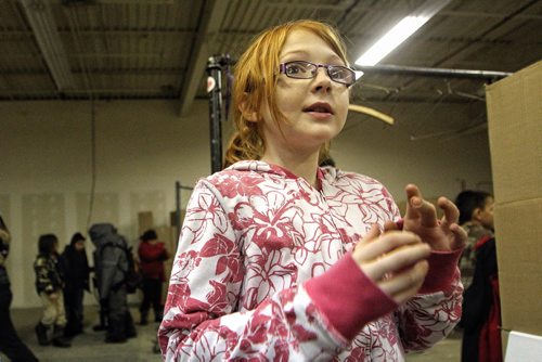 Grade four student, Ryan Redwood, 9, from Elwick Community School talks about her experience helping to make 250 hampers for the Christmas Cheer Board. 131217 - December 17, 2013 MIKE DEAL / WINNIPEG FREE PRESS