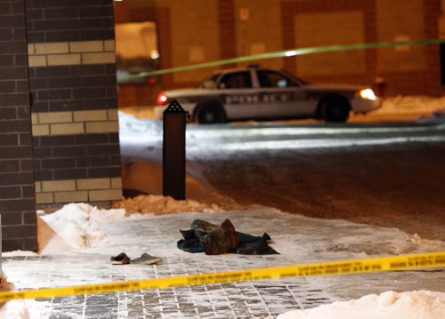 Winnipeg Police have a back alley behind the United Way building on Main St. at Alexander Ave. taped off Wednesday morning.  Shoes and what appears to be a jacket near the back door.  Alexander Ave. at Main is closed to traffic. Wayne Glowacki / Winnipeg Free Press Dec.18. 2013
