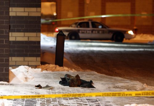 Winnipeg Police have a back alley behind the United Way building on Main St. at Alexander Ave. taped off Wednesday morning.  Shoes and what appears to be a jacket near the back door.  Alexander Ave. at Main is closed to traffic. Wayne Glowacki / Winnipeg Free Press Dec.18. 2013