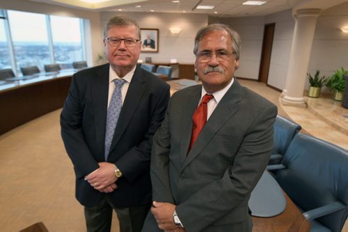 Don Douglas,left, managing partner of Winnipeg law firm, Thompson Dorfman Sweatman, and Paul Roy,right, managing partner of Roy Johnston in Brandon. The two firms have merged, it's part of TDS's strategy to expand outside of the Perimeter Highway-See Geoff Krybson story- Dec 20, 2013   (JOE BRYKSA / WINNIPEG FREE PRESS)