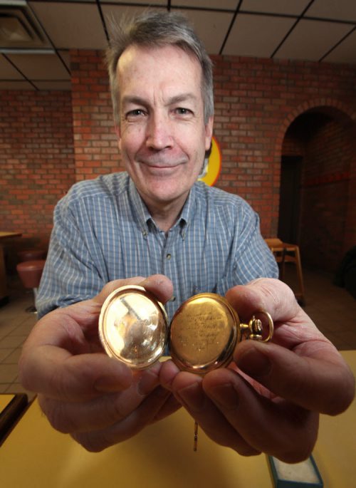 Bruce Popham with his grandfather's watch. Wendie Steppler and her father Dick returned the watch after 50+ years Friday. See story. December 20, 2013 - (Phil Hossack / Winnipeg Free Press)