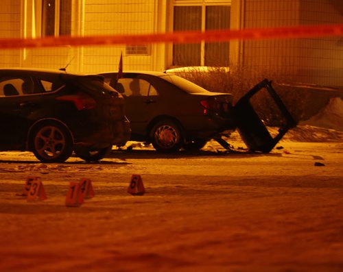 WPS and cadets are guarding a crime scene in the parking lot of a large apartment building at 445 Partridge Ave  at McGregor St.  , evidence markers  are set up in the parking lot as well a  a car door separated from it's body . Unclear what has transpired at this time but the police have been on scene all night.   - Dec. 23 2013 / KEN GIGLIOTTI / WINNIPEG FREE PRESS