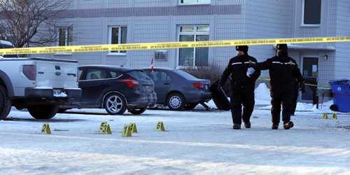 A  van  with doors open  is still at the scene where it hit    the apartment building's parking  area barrier  near the front entrance - WPS  forensics  and cadets are guarding a crime scene of a shooting with the victim in stable condition  in the parking lot of a large apartment building at 445 Partridge Ave  at McGregor St.  , blood marked by evidence markers  are set up in the parking lot as well a  a van  door separated from it's body . The police have been on scene all night.   - Dec. 23 2013 / KEN GIGLIOTTI / WINNIPEG FREE PRESS