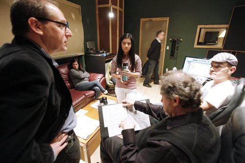 December 17, 2013 - 131217  -  Maria Aragon (C) listens in as Steven Nowack (L), Aragon's manager, John Paul Peters (R), music producer, and Yuri Klaz (2nd R)), artistic director/conductor with the Winnipeg Philharmonic Choir discuss details at Private Ear recording studio Tuesday, December 17, 2013. JOHN WOODS / WINNIPEG FREE PRESS