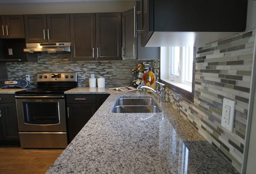 Homes. The kitchen in a new home at 338 Eagleview Road in Bridgwater Lake,  Signature Homes Jeff McArthur is the realtor. Todd Lewys story Wayne Glowacki / Winnipeg Free Press Dec.23. 2013