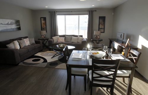 Homes. The dining area and living room in a new home at 338 Eagleview Road in Bridgwater Lake,  Signature Homes Jeff McArthur is the realtor. Todd Lewys story Wayne Glowacki / Winnipeg Free Press Dec.23. 2013