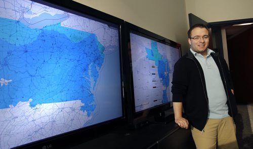 Finance.  Matthew Hudson,CEO of Invenia Technical Computing Corporation with monitors showing realtime pricing markets of the PJM (left) and MISO electrical grids.  Invenia is a small company using Big Data to do all sorts of forecasting analytics related to the energy markets. Martin Cash  story Wayne Glowacki / Winnipeg Free Press Dec.23. 2013