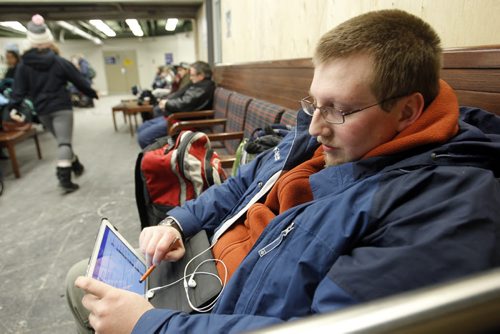 Corrie Rogge passing time in Union Station in Winnipeg waiting for his east bound train to arrive.  Mary Agnes Welch story Wayne Glowacki / Winnipeg Free Press Dec.23. 2013
