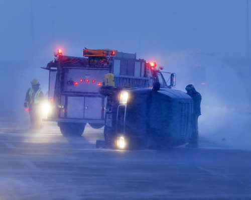 Dangerous conditions outside the city - Two vehicle  rollover MVC on the Perimeter Hwy  just west of McPhillips St. in wild  weather , low visibility  high winds  sent cars off the road  on routes coming into Wpg .  Dec. 24 2013 / KEN GIGLIOTTI / WINNIPEG FREE PRESS