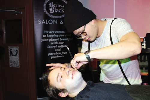 Canstar Community News George Grenier holds still while Berns and Black barber Andrew Van gives him a close, straight razor shave. Festival du Voyageurís 32nd annual beard-growing contest kicked off Thursday evening at Le Garage CafÈ, with contestants getting a clean shave up on stage before the beard growing begins. (JORDAN THOMPSON)