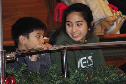 Canstar Community News Two youngsters enjoy Daniel McIntyre Collegiate's Christmas Concert at the First Mennonite Church of Winnipeg. (JORDAN THOMPSON)