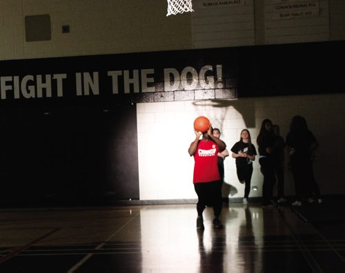 Canstar Community News Dec. 11, 2013 -- Steve Tackie, Sturgeon Heights Collegiate English teacher, warms up for the Pros vs. Joes competition.