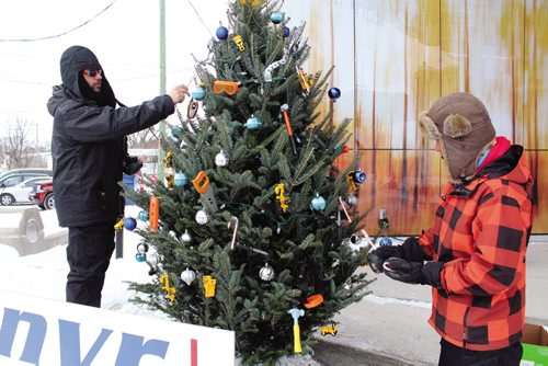 Canstar Community News Some local businesses were trimming trees Thursday afternoon as part of the Transcona BIZís first Christmas tree decorating competition. (JORDAN THOMPSON)