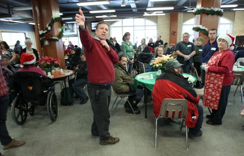 Siloam Misson Executive director Floyd Perras welcomes all to Christmas Eve dinner at the Siloam Mission this afternoon- 500 guests will be served by 110 volunteers eating 95 turkeys, 450 lbs of potatoes, and 85 pies- Standup photo- Dec 24, 2013   (JOE BRYKSA / WINNIPEG FREE PRESS)