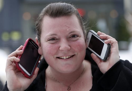 Phone Use Streeter - 8 photos  - Local matcher to CP story Äì in pic wit two phones , one for work and the other personal  is Marla Wojcik  age 32 -   HL:Nearly 50% of Canadian mobile users say their device is on hand 24/7: pollTORONTO Äî If you canÄôt bear to let your smartphone out of your sight for even a few minutes, youÄôre not alone.According to the results of a recently released online poll, almost half of Canadian smartphone owners said they keep their device with them pretty much 24/7.About 42 per cent of the respondents in the survey, conducted by Harris-Decima for Rogers, said they keep their phone within reach for 90 to 100 per cent of the day.The average response was 70 per cent of the day, or almost 17 hours. Dec. 27 2013 / KEN GIGLIOTTI / WINNIPEG FREE PRESS