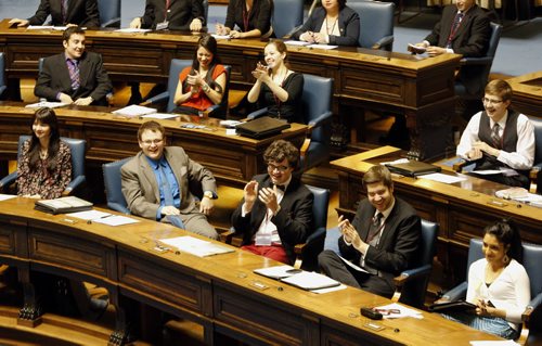 Honourable members - In Pic Premier Andrew Jones (in bow tie third from right)gives applause  and laughter after a question was returned  in rap verse  from the opposite side of the house , with other members during debate - Youth Parliament of Manitoba regarding the second day of our 92nd Winter Session. Dec. 27 2013 / KEN GIGLIOTTI / WINNIPEG FREE PRESS