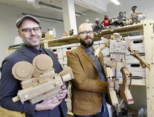 At left is Christian (hat) and brother Sean Procter. They are the Procter Bros. Industries, a filmmaking duo that have been making some stop-motion music videos. They are in their studio in the Exchange with some of their props they have made. JEN ZORATTI story Wayne Glowacki / Winnipeg Free Press Dec.27. 2013