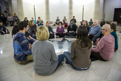 131227 Winipeg - DAVID LIPNOWSKI / WINNIPEG FREE PRESS (December 27, 2013)  Modern Mystery School Guide, Healer & Ritual Master, as well as Creator of Joy Yoga, Sarah Hauch leads a night of meditation, community, clearing and creation on the pool of the black star at the Manitoba legislative building Friday December 27, 2013.    "The theme of the night is to re-inspire and re-ignite the magic in Winnipeg, so that we may all have our dreams come true in 2014."