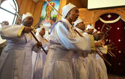 Choir members and clergy sing hymns and dance at the Ethiopian Orthodox Church on Mountain Avenue during Sunday service at the church on Sun., Dec. 29, 2013. RE: Mary Agnes Welch story Photo by Jason Halstead/Winnipeg Free Press