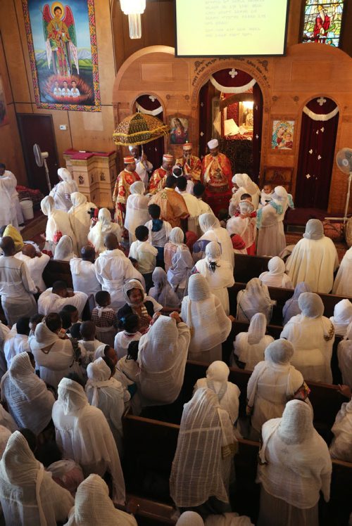 Congregation members receive communion at the Ethiopian Orthodox Church on Mountain Avenue during Sunday service at the church on Sun., Dec. 29, 2013. RE: Mary Agnes Welch story Photo by Jason Halstead/Winnipeg Free Press