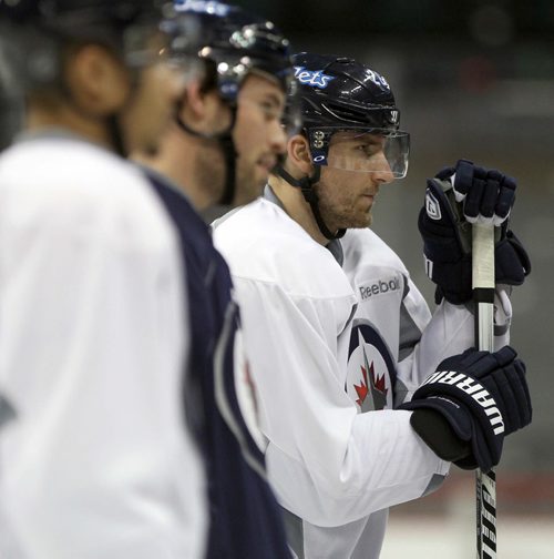 Winnipeg Jets star forward Blake Wheeler, right, at practice Monday afternoon at the MTS Centre  - The Winnipeg Jets are in preparation for a home game tomorrow night against the Buffalo Sabers - Standup photo- Dec 30, 2013   (JOE BRYKSA / WINNIPEG FREE PRESS)