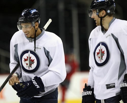 Winnipeg Jets star forward Blake Wheeler, right, has a laugh with Evander Kane at practice Monday afternoon at the MTS Centre  - The Winnipeg Jets are in preparation for a home game tomorrow night against the Buffalo Sabers - Standup photo- Dec 30, 2013   (JOE BRYKSA / WINNIPEG FREE PRESS)