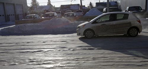 Icy rutted patches on Logan Ave. near Hwy. 90 Monday. For story Wayne Glowacki / Winnipeg Free Press Dec.30. 2013
