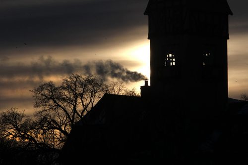 The sun rises on the first day of 2014 next to a smoke stack on the Assiniboine Park Pavilion Wednesday morning on New Year's Day. Jan 01, 2014 Ruth Bonneville / Winnipeg Free Press