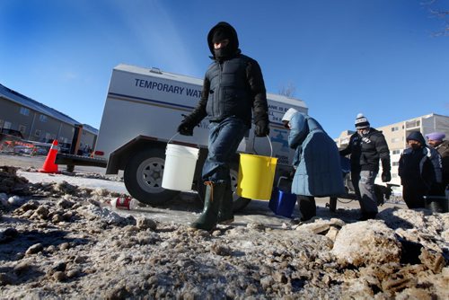 Enrique Roque carries water makes his way beck to his home off Jefferson Ave after lining up for water at a temporary water supply station set up for people living in the area of a major water main break. Jan 01, 2014 Ruth Bonneville / Winnipeg Free Press
