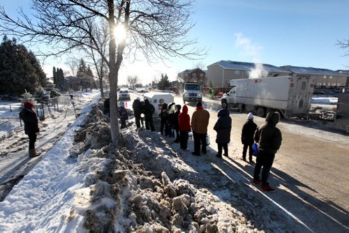 Residents living near water main break off  Jefferson Ave line up to fill water jugs  at a temporary water supply station after  major water main break on New Years Eve Day.  Jan 01, 2014 Ruth Bonneville / Winnipeg Free Press