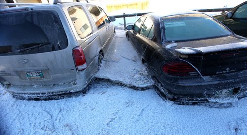 Vehicle stuck in ice after  major water main break on New Years Eve Day on Jefferson. Jan 01, 2014 Ruth Bonneville / Winnipeg Free Press