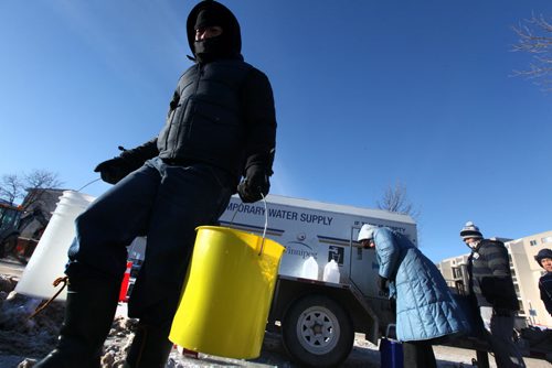 Enrique Roque carries water makes his way beck to his home off Jefferson Ave after lining up for water at a temporary water supply station set up for people living in the area of a major water main break. Jan 01, 2014 Ruth Bonneville / Winnipeg Free Press