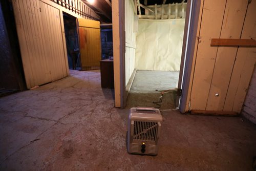 A small space heater in the basement of a Maryland Street apartment building that is without heat after the boiler failed, Wednesday, January 1, 2014. (TREVOR HAGAN/WINNIPEG FREE PRESS)