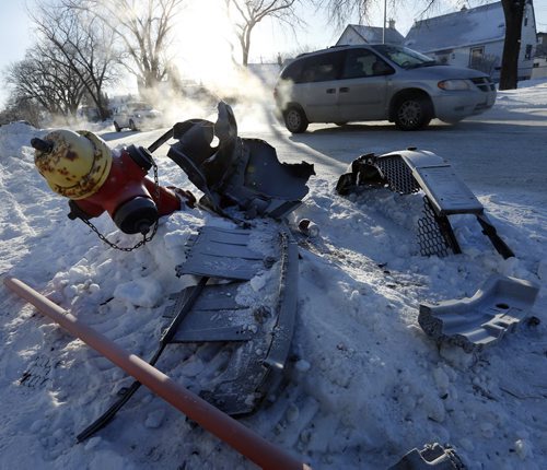 Stdup - Collateral Damage of the cold , leaving  car parts  and infrastructure damage at various intersections around the city including  this fire hydrant a Arlington St at Burrows Ave ,- 33 , with rutted icy streets everywhere ,  JAN. 2 2014 / KEN GIGLIOTTI / WINNIPEG FREE PRESS