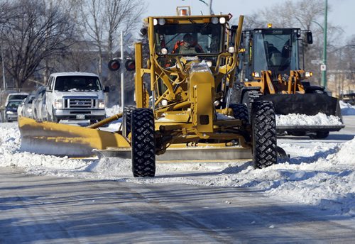 Winnipeg City Snow Ploughing operations a begun to clear and scrape hard packed streets  from the last snowfall  ,JAN. 2 2014 / KEN GIGLIOTTI / WINNIPEG FREE PRESS