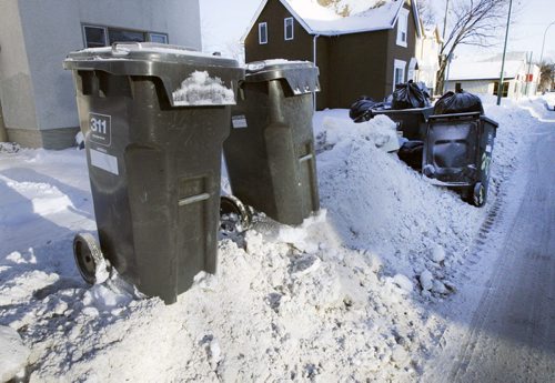 Garbage bins piled on snowbanks at 283 Mountain Ave in Winnipeg  See story- Jan 02, 2014   (JOE BRYKSA / WINNIPEG FREE PRESS