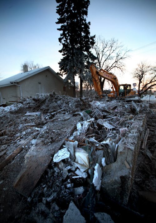 A frosty pile of rubble is all that remains at Havelock and St Mary's Rd after a fire New Years Day. See story. Jan 2, 2014 - (Phil Hossack / Winnipeg Free Press)