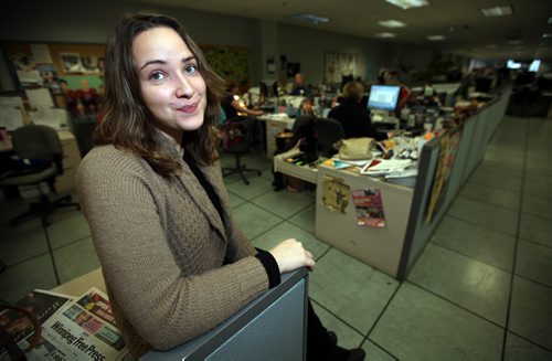 Free Press intern Veronika Gorlova poses in our newsroom Friday afternoon. See her story. January 3, 2014 - Phil Hossack / Winnipeg Free Press)