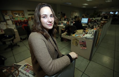 Free Press intern Veronika Gorlova poses in our newsroom Friday afternoon. See her story. January 3, 2014 - Phil Hossack / Winnipeg Free Press)