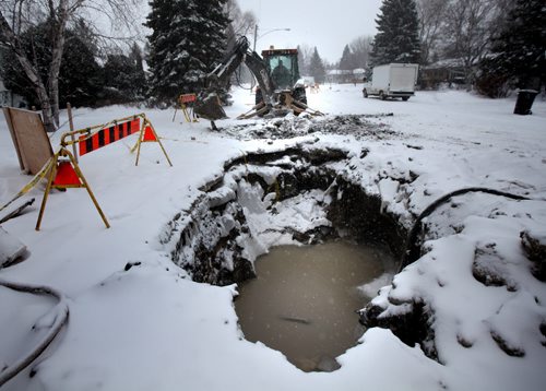 Ditches and excavations flooded with water along Laxdal rd in Charleswood Friday afternoon. See Kevin Rollason story. January 3, 2014 - Phil Hossack / Winnipeg Free Press)