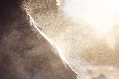 Snow dust swirls off of a drift during a strong wind on North Drive in the early morning sunshine, Saturday, January 4, 2014. (TREVOR HAGAN/WINNIPEG FREE PRESS)