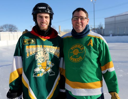 Jacob McMahon and his father, Tom McMahon of the Tumbleweeds spongee team following their game against the Mighty Puckin Drunks at Melrose Community Centre, Saturday, Wednesday, January 4, 2014. The Tumbleweeds are the oldest spongee team in the world. (TREVOR HAGAN/WINNIPEG FREE PRESS) - for dave sanderson