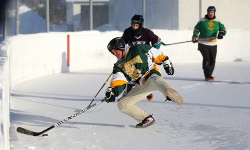 Colin Mackenzie of the Tumbleweeds, loses his footing while playing against the Mighty Puckin Drunks during a spongee game at Melrose Community Centre, Saturday, Wednesday, January 4, 2014. The Tumbleweeds are the oldest spongee team in the world. (TREVOR HAGAN/WINNIPEG FREE PRESS) - for dave sanderson