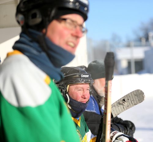 Tom McMahon, top, and Rich Normandeau watch from the bench during the Tumbleweeds spongee game agaist the Mighty Puckin Drunks at Melrose Community Centre, Saturday, Wednesday, January 4, 2014. The Tumbleweeds are the oldest spongee team in the world. (TREVOR HAGAN/WINNIPEG FREE PRESS) - for dave sanderson