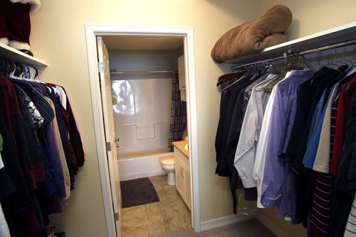 Homes. The walk-in closet between the master bedroom and the bathroom in the condo in Legend at Creek Bend Condominiums, 1205 St. Annes Road. The is realtor Laura Fouad. Todd Lewys  story.Wayne Glowacki / Winnipeg Free Press Jan.7  2014