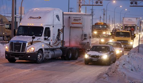 Stdup , large rush hour traffic tie up on King Edward ST.  just south of Saskatchewan Ave has traffic down to one lane ,but trafffic is slowing moving around it , extreme cold and  road coditins have cars spinning out  in minor mvc's all over the city  JAN. 8 2014 / KEN GIGLIOTTI / WINNIPEG FREE PRESS