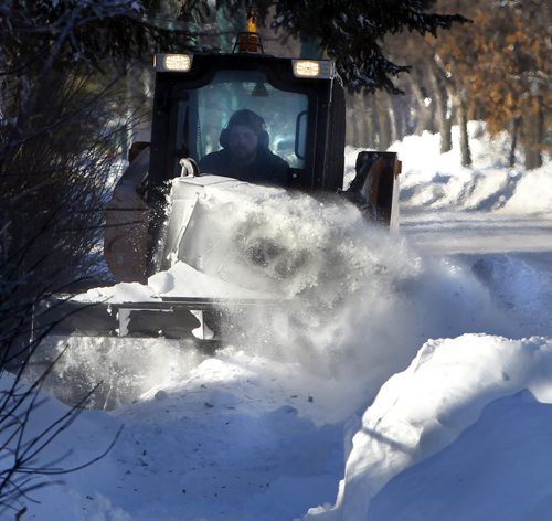 Snowblower pushes through the snow clearing the sidewalk along Burrows Ave. Wednesday afternoon.    Wayne Glowacki / Winnipeg Free Press Jan.8  2014