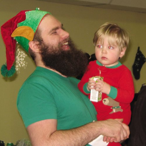 Canstar Community News Dec. 13, 2013 - North End Family Centre staff member Stephen Bueckert and his son Jesse. (JARED STORY/THE TIMES/CANSTAR COMMUNITY NEWS)