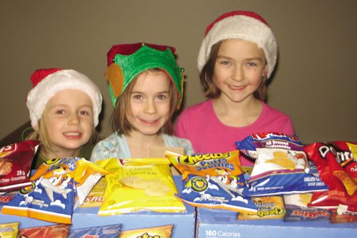 Canstar Community News Dec. 13, 2013 - (Left to right) Maddy, Sadie and Stephanie made sure everyone had chips. (JARED STORY/THE TIMES/CANSTAR COMMUNITY NEWS)